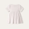 Vestido de bebé con números pequeños Vestido de bebé con números pequeños